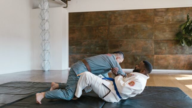 Two Men in Karate Uniform Sparring