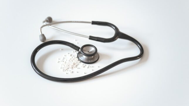 black and silver stethoscope on white surface
