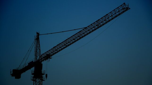 black metal crane tower under blue sky