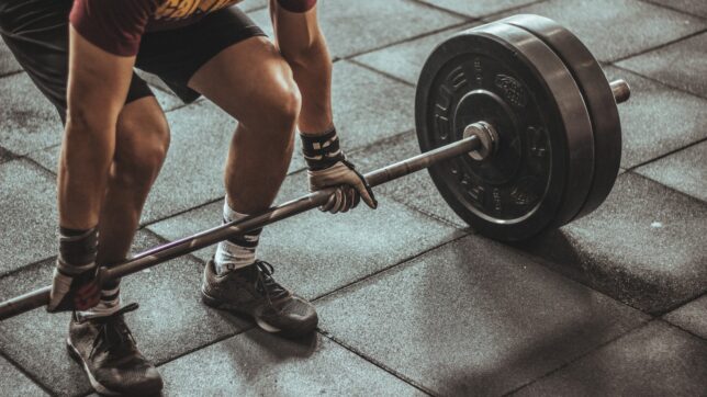 person weightlifting painting